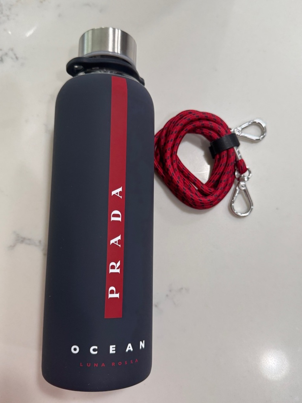 Prada Black Luna Rossa Ocean Water Bottle Boxed comes with carrying strap
